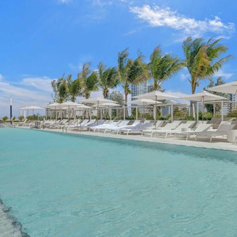Soak up the sun beside the communal swimming pool