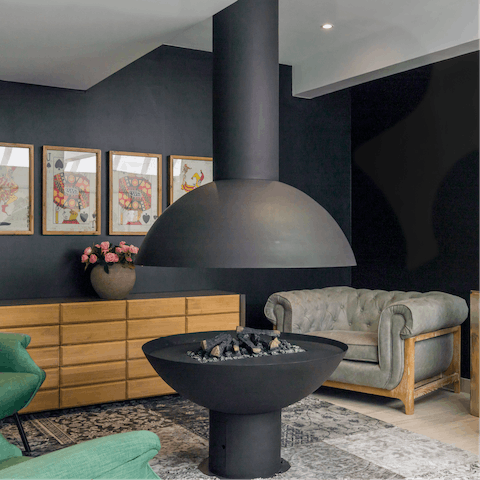 Relax around the shared lounge's indoor fire pit