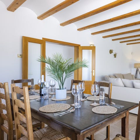 Dine on an authentic paella around your stylish dining set
