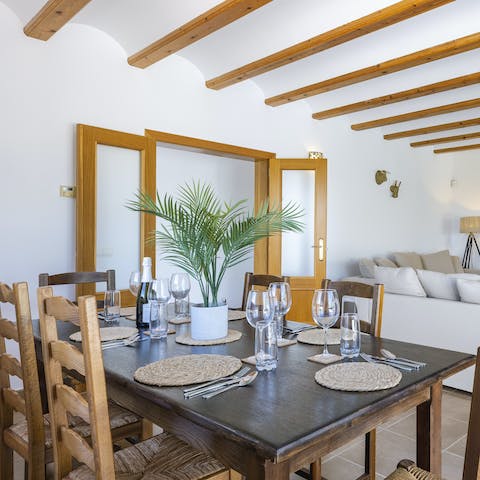 Dine on an authentic paella around your stylish dining set