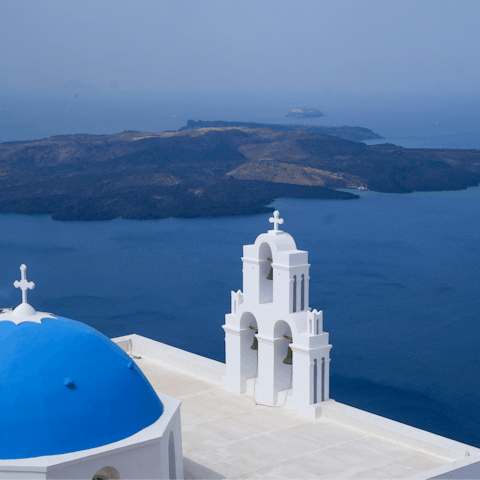 Enjoy incredible views across the caldera while exploring  Imerovigli