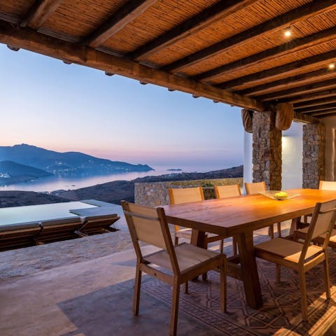 Dine at sunset and admire the coastline streaked blue and purple
