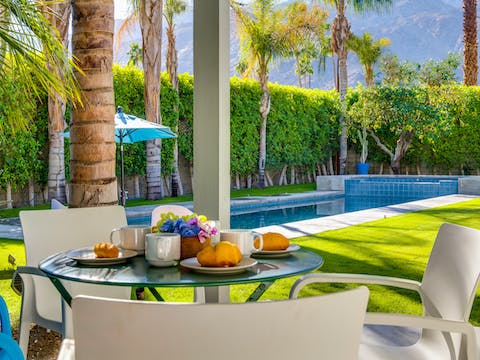 Dine alfresco under the palm trees
