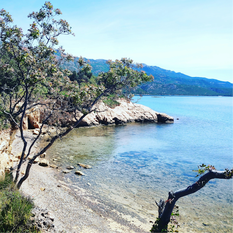 Explore the rocky cove of Guvnina beach, five-minute drive away