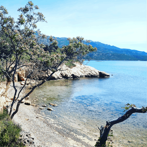 Explore the rocky cove of Guvnina beach, five-minute drive away