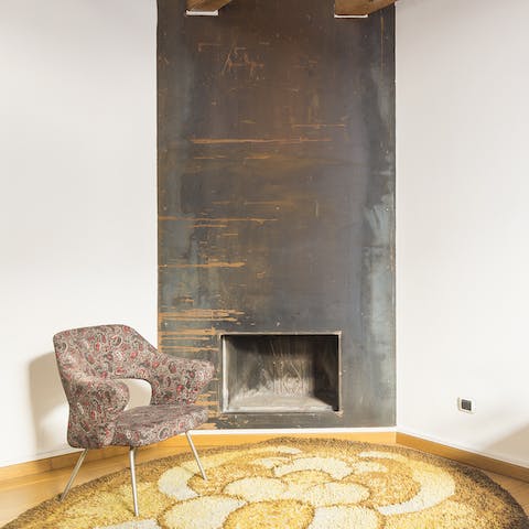 Curl up with a good book by the master bedroom's fireplace