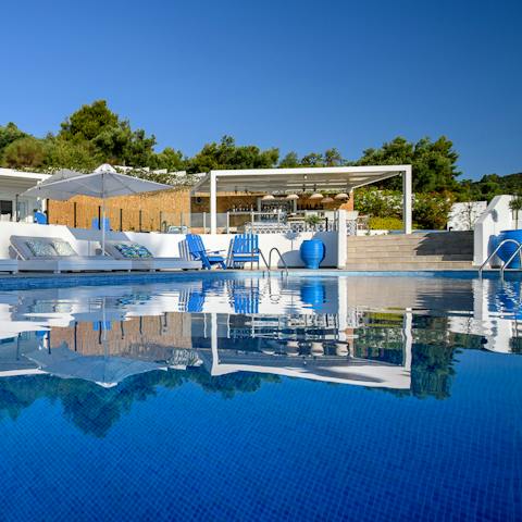 Grab a drink by the minibar before heading to the pool-side