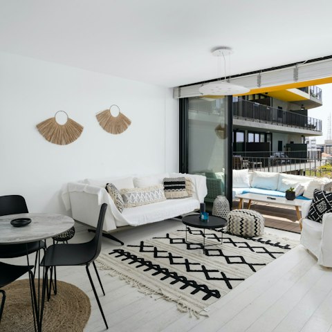 Relax in the open living area with a glass of wine after a day exploring Jaffa