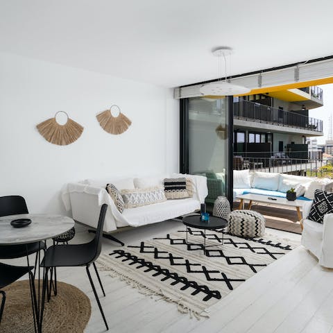 Relax in the open living area with a glass of wine after a day exploring Jaffa