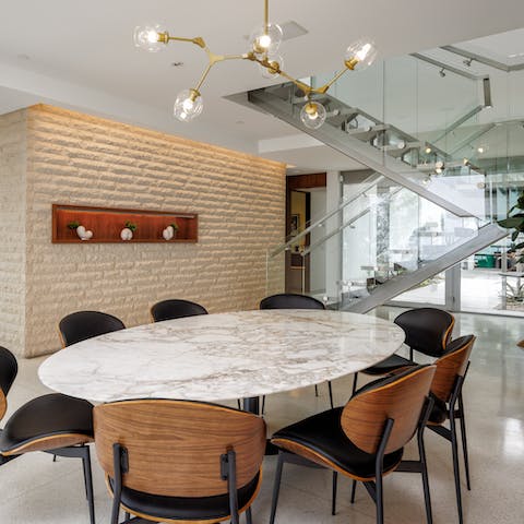 Gather for elegant dinners and laid-back meals at the stylish dining table