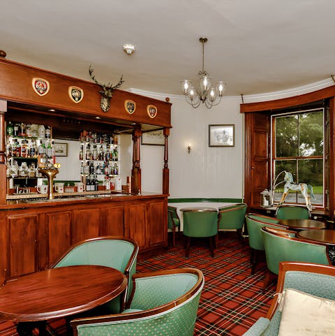 Pull pints or sample local whiskey in the private pub