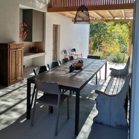 Dine alfresco, yet covered, in the dedicated outdoor dining room