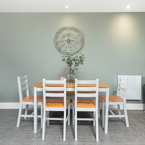 Come together for meals around the sleek dining area