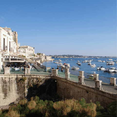 Explore Ortigia's port, a short stroll down the road