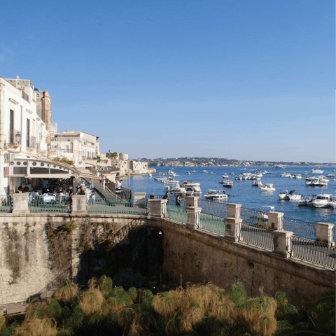 Explore Ortigia's port, a short stroll down the road