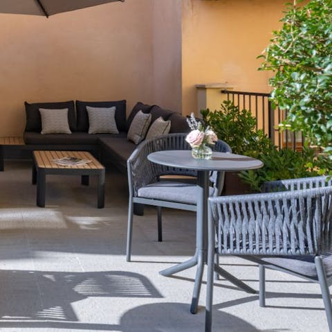 Pause and relax with drinks on the shared terrace