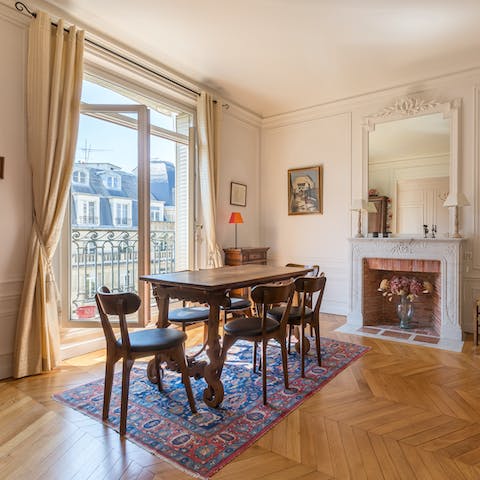 Throw open the balcony doors and gather around the elegant dining table