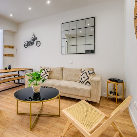 Enjoy a glass of champagne on the comfy sofa
