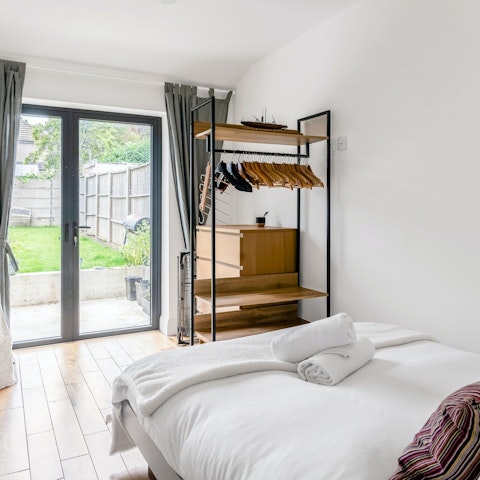 Wake up to pleasant garden views in the minimalist bedroom