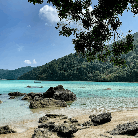 Spend your days in the crystalline waters of Surin Beach, just 700m away