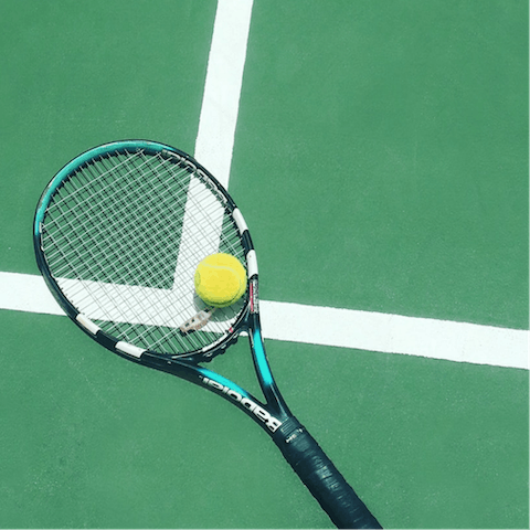 Have a game of tennis on the nearby court