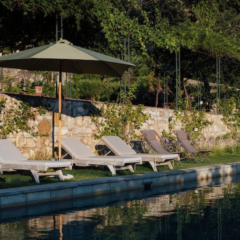 Set yourself up in a prime location by the pool, only moving for mealtimes and refreshing dips in the water