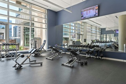 Train in the on-site with city views through the floor-to-ceiling windows