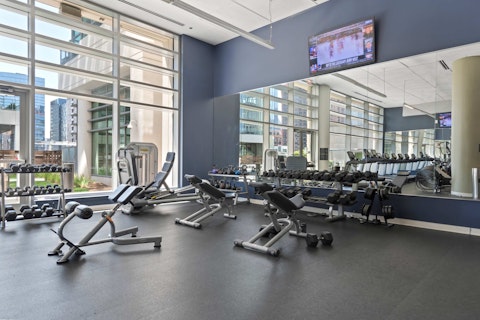 Train in the on-site with city views through the floor-to-ceiling windows
