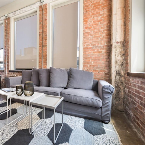 Find a sunny reading spot by the industrial-styled windows