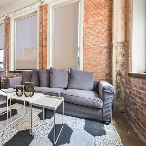 Find a sunny reading spot by the industrial-styled windows