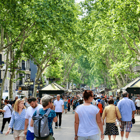 Drink in the atmosphere on Las Ramblas, a ten-minute stroll away
