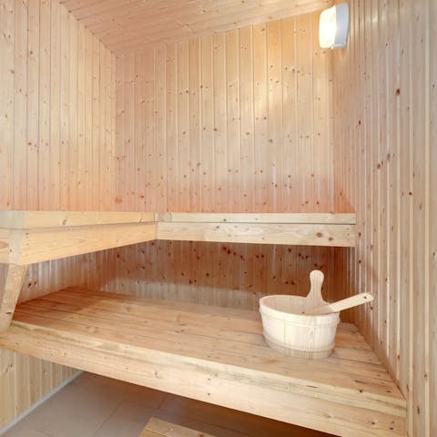 Unwind sore muscles in the private sauna