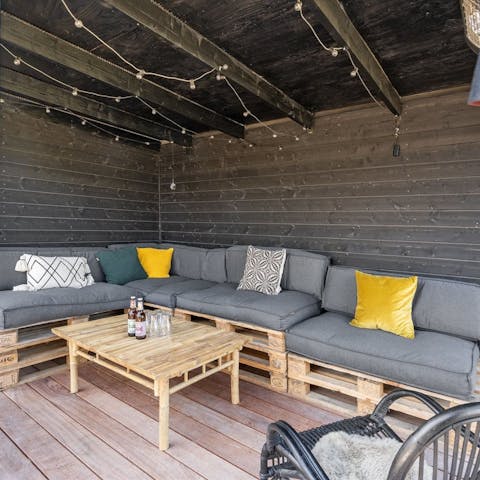 Gather on the covered terrace for alfresco drinks