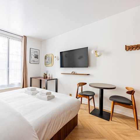 Watch TV in bed, in the compact yet cleverly designed space