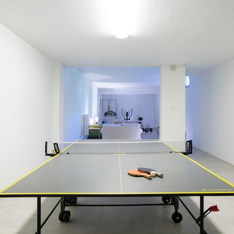 Set up a friendly game of ping pong in the games room