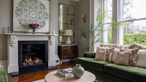 Sink into velvet sofas in front the fire