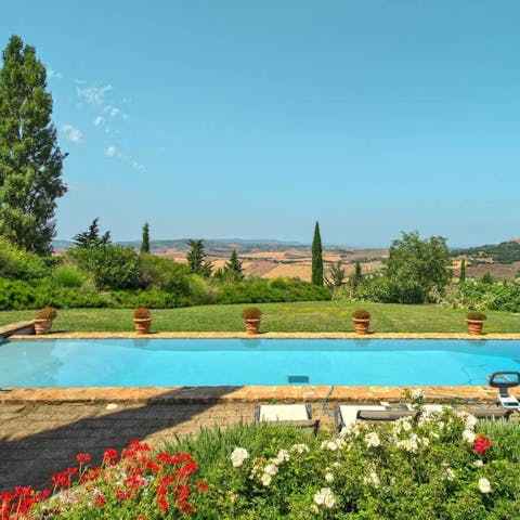Take a dip in the private pool overlooking rolling hills