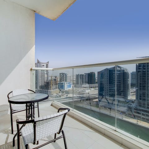 Look out to the Dubai Canal from your private balcony