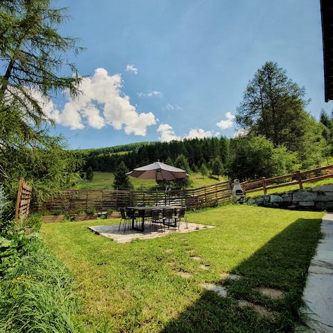Gaze out over an Alpine meadow from the dining spot in the garden