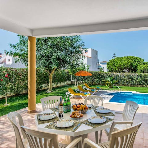 Feast on a brunch of Portuguese pastries at the outdoor dining table