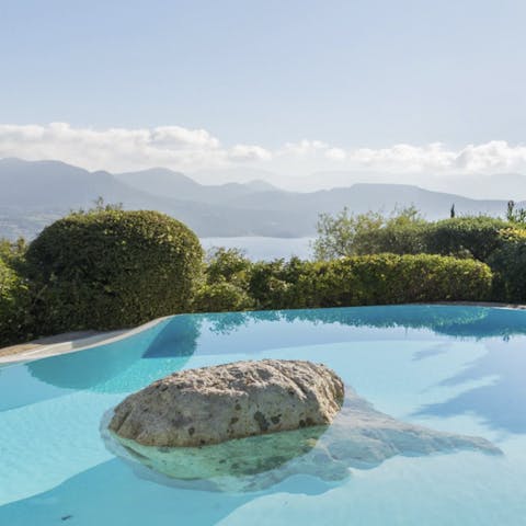 Take a plunge into your private pool surrounded by manicured garden