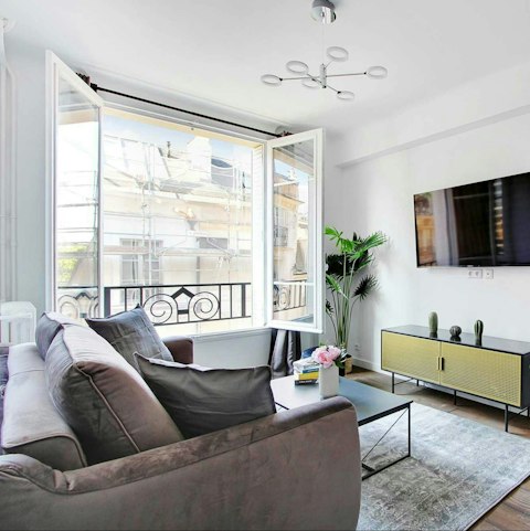 Curl up in the living room as Paris light pours in