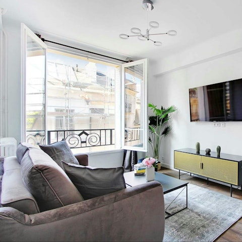 Curl up in the living room as Paris light pours in