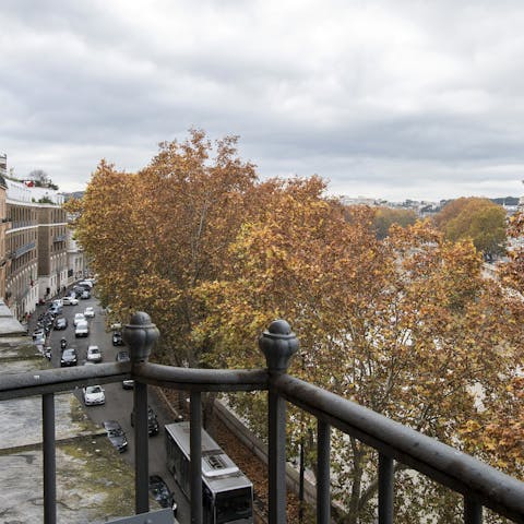 Take in views over the River Tiber from the balcony, a glass of Italian wine in hand