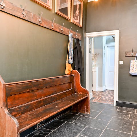 Contain the mess of muddy walks along one of the riverside footpaths in this home’s bespoke boot room