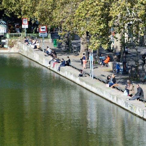 Take a twelve-minute stroll to the tranquil waterway of Canal Saint-Martin
