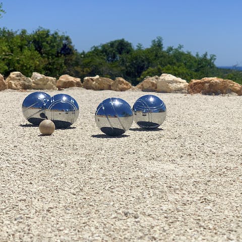 Play a few games of bocce ball on sunny afternoons