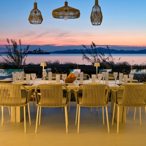 End the day sharing dinner and drinks outside at sunset