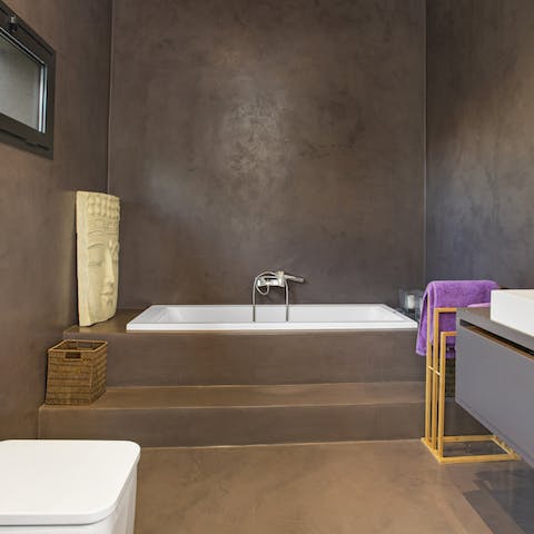 Treat yourself to a soak in the sunken bathtub