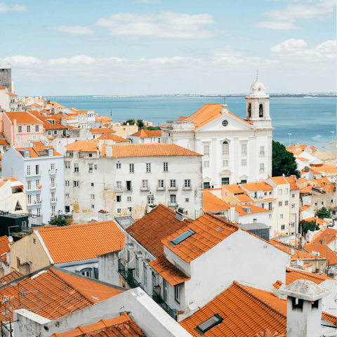 Marvel at views from Castelo de São Jorge, fifteen minutes away